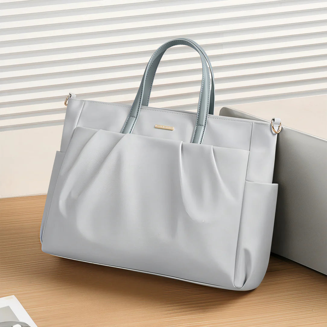 Sac à main structuré gris avec poignées brillantes - Golf Repair, style et élégance
