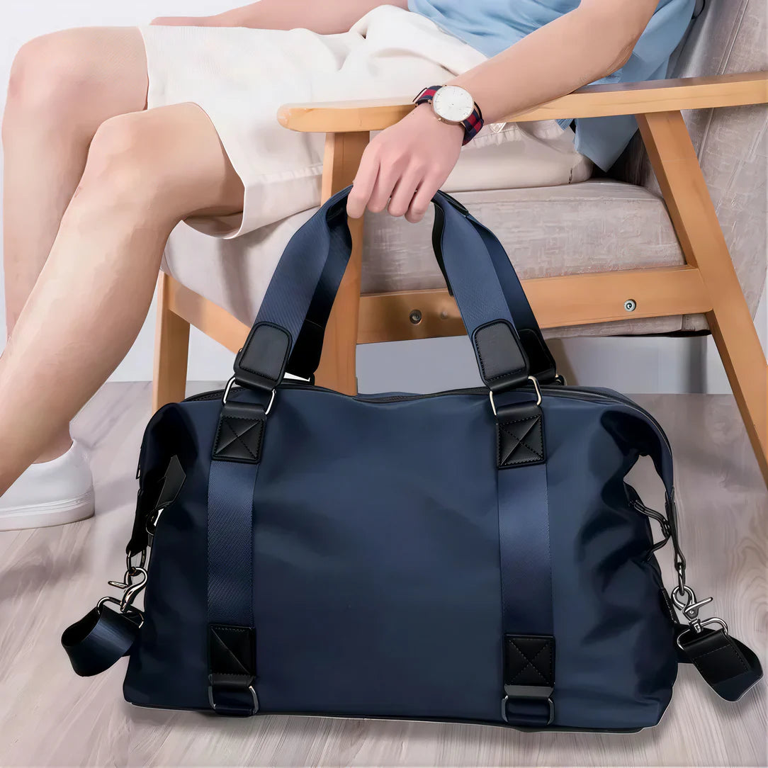 Petit sac de voyage Vectra en bleu avec accents noirs, idéal pour courts séjours