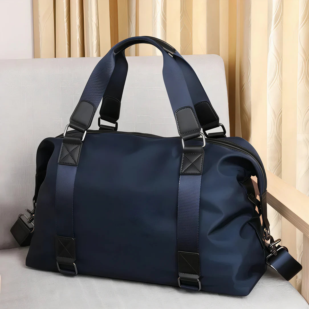 Sac de voyage navy blue Vectra avec accents noirs, idéal pour petits sacs et courts séjours