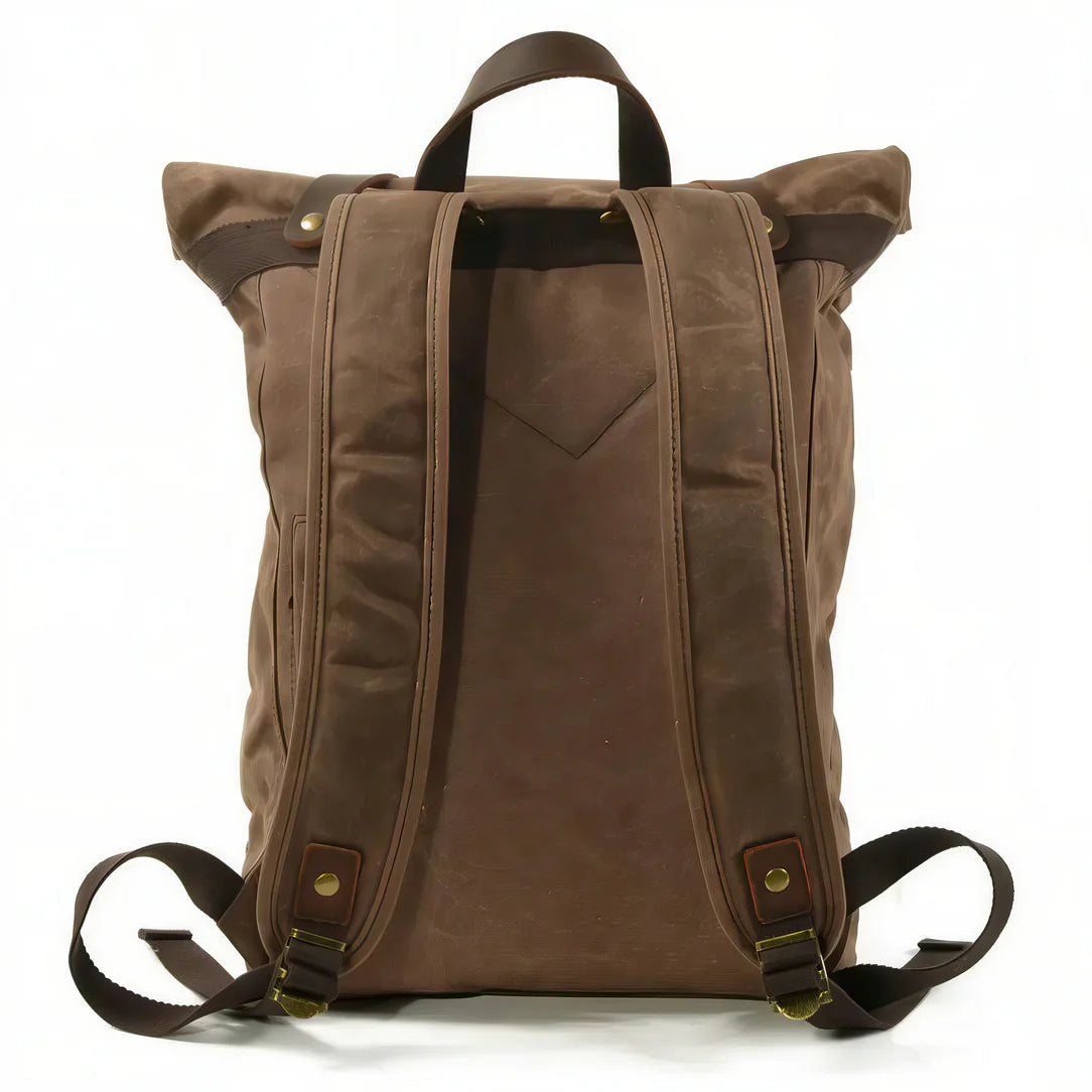 Sac à dos baroudeur Nomad en toile marron pour aventure et style.</assistant
