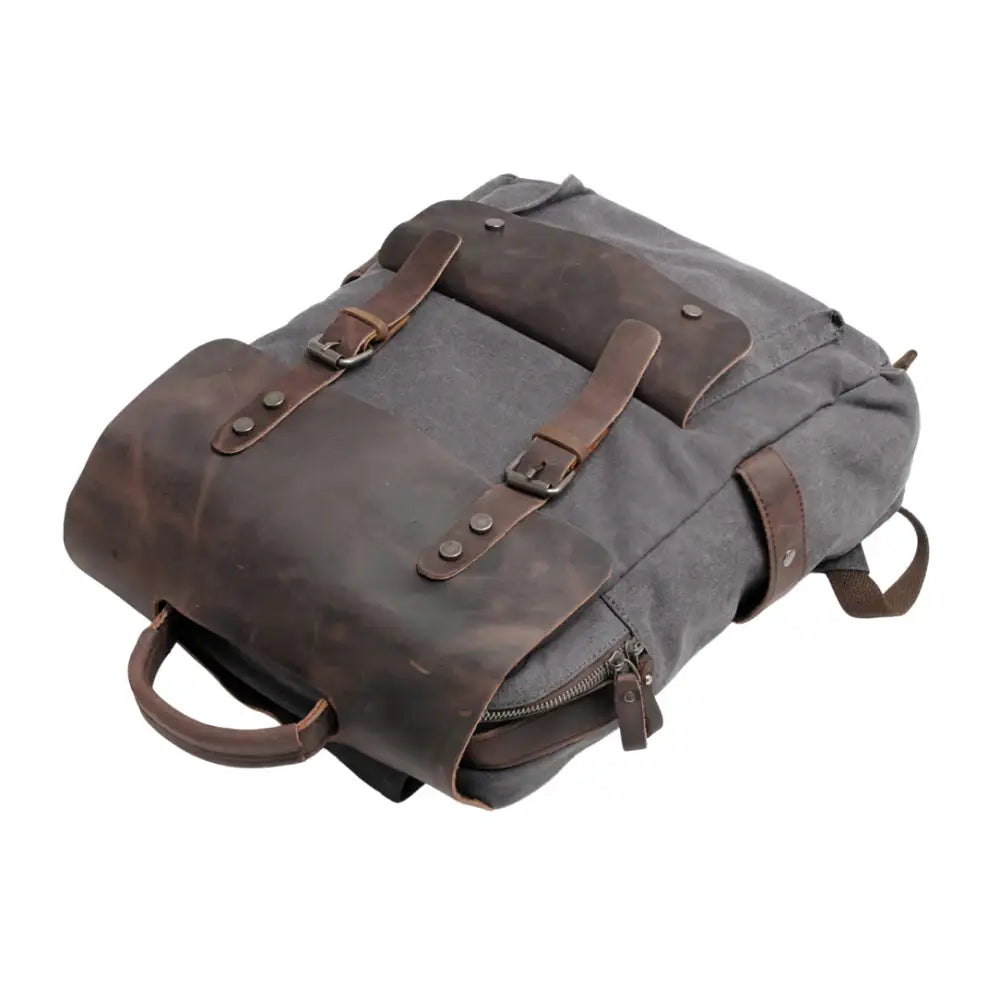 Sac à dos en cuir vintage gris avec accents en cuir marron pour un style élégant