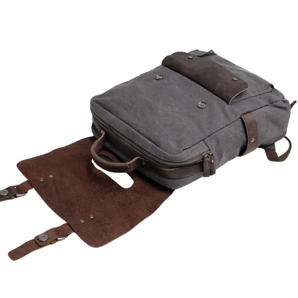 Sac à dos en cuir vintage gris avec accents en cuir marron, style élégant et fonctionnel