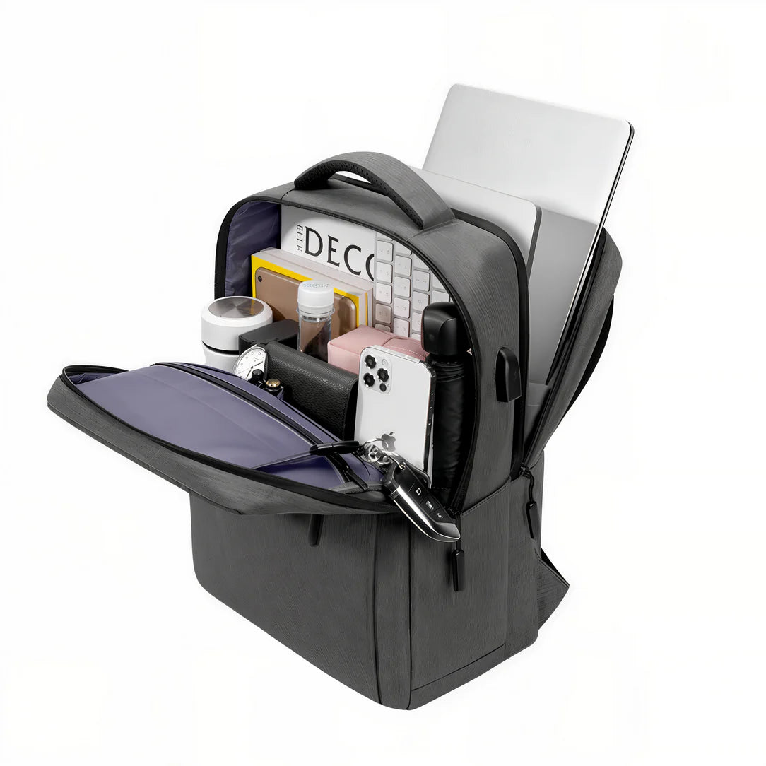 Sac à dos étudiant ordinateur Logedia One ouvert avec divers accessoires, parfait pour ordinateur Logedia