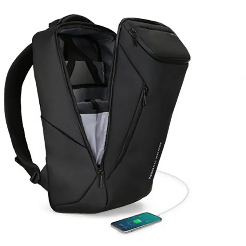 Sac à dos noir ouvert avec téléphone à charger.