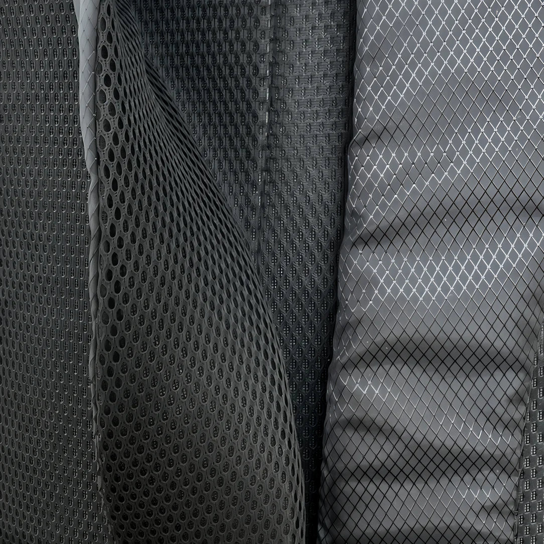 Sac à dos roll top de ville en mesh noir et tissu à motif diamant