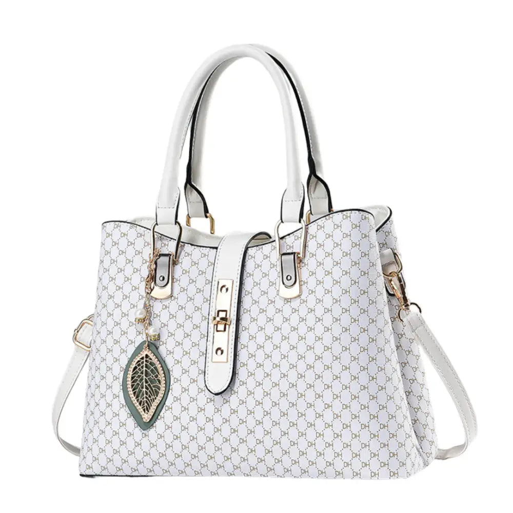 Sac à main classique blanc avec motif et charm feuille pour un style élégant