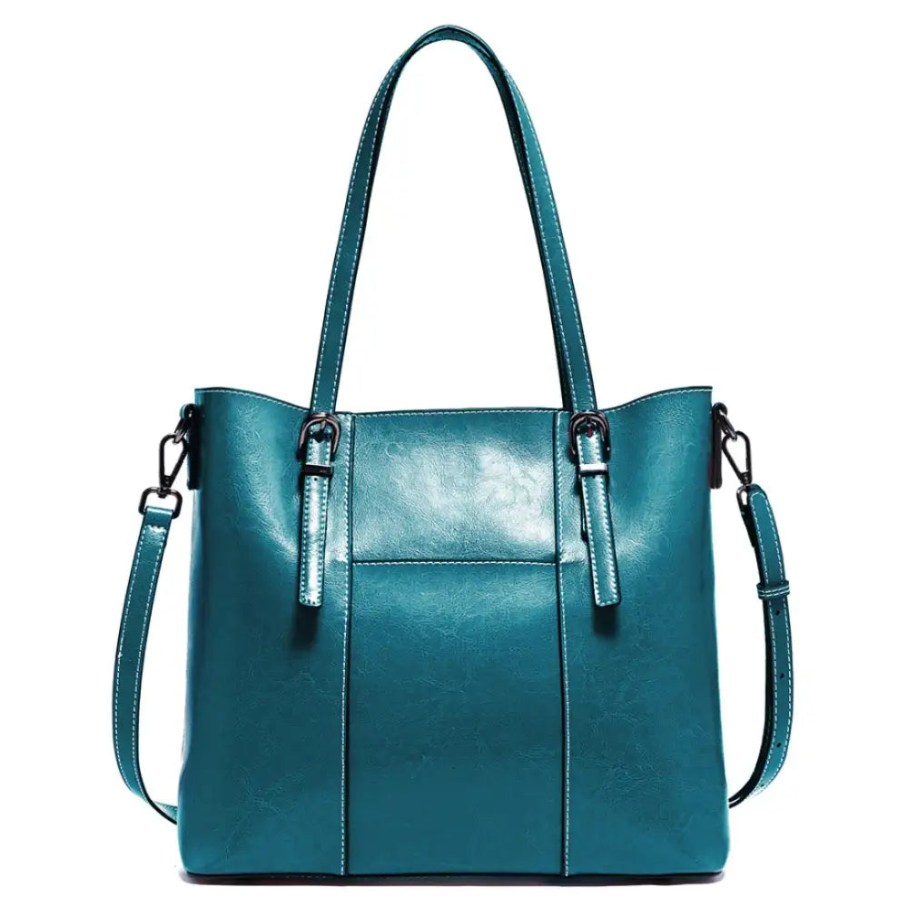 Sac à main porté épaule en cuir teal, idéal pour bureau aux sorties