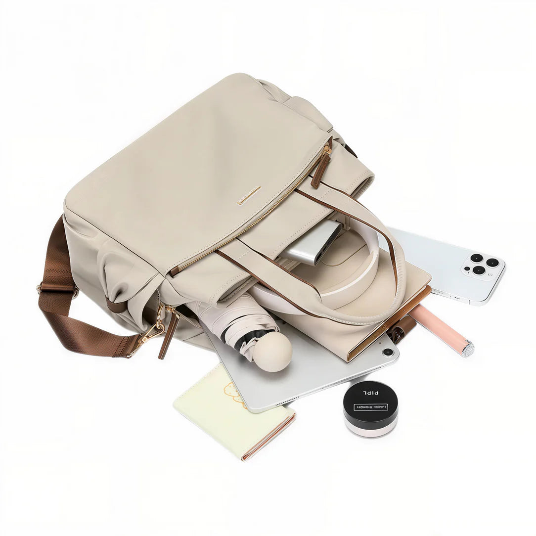 Sac à main tendance Mirel en cuir beige avec contenu, style et élégance principale