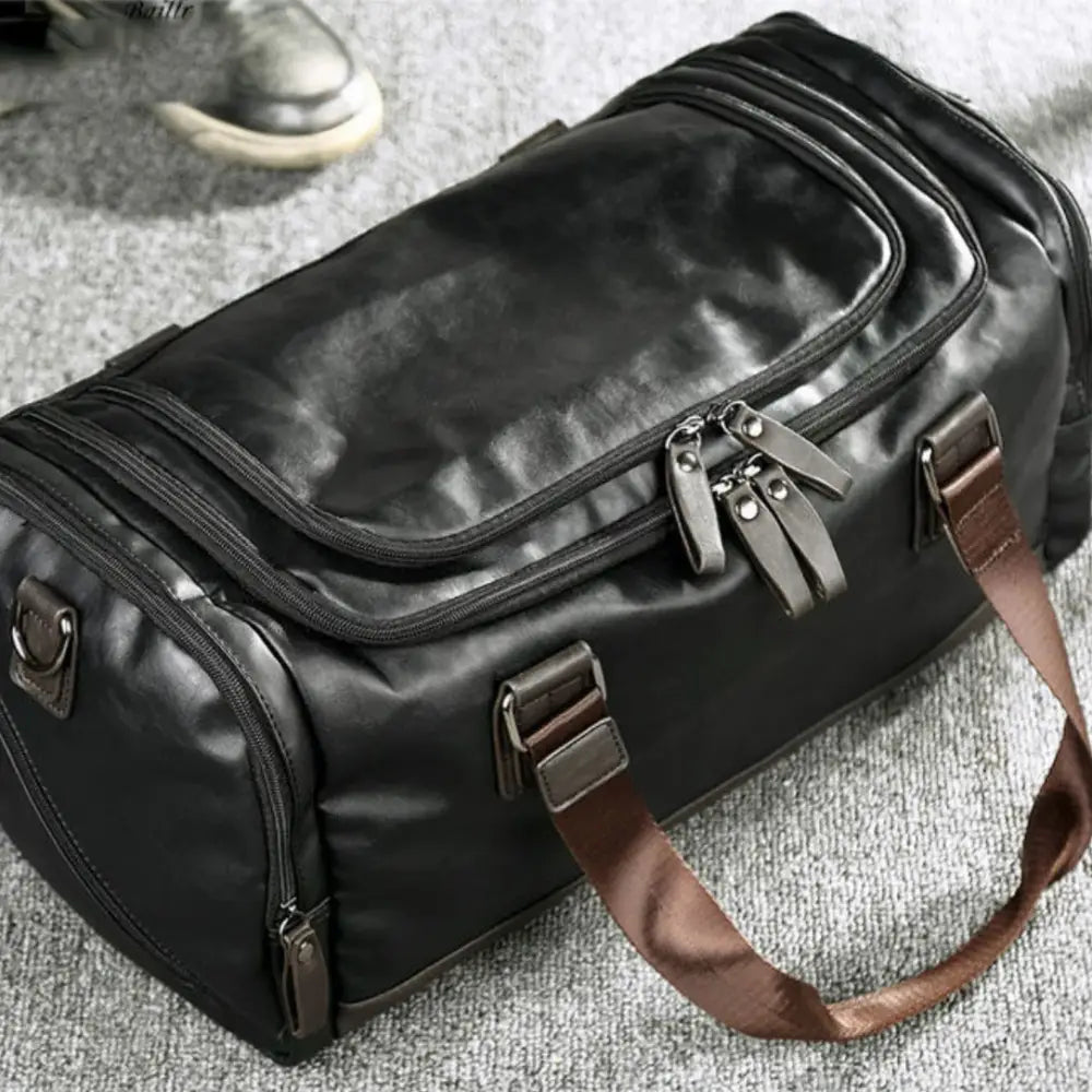 Sac de voyage en cuir vintage OldSmith avec cuir noir et bretelles marron