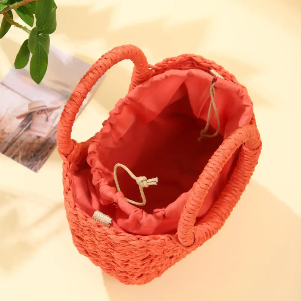 Sac demi lune en paille avec poignée orange tressée et fermeture à cordon