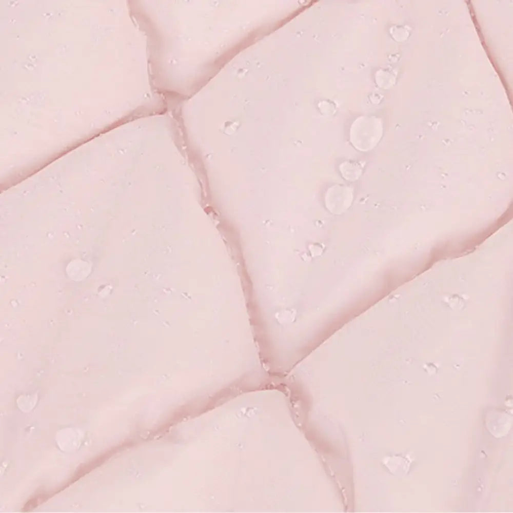 Sac fourre matelassée rose avec gouttelettes d’eau pour un look élégant et tendance