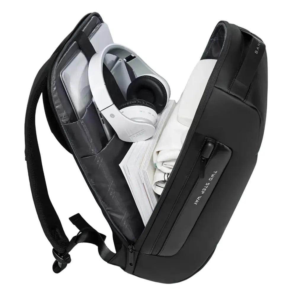 Sac à dos antivol ordinateur noir ouvert avec écouteurs blancs pour sécurité et style