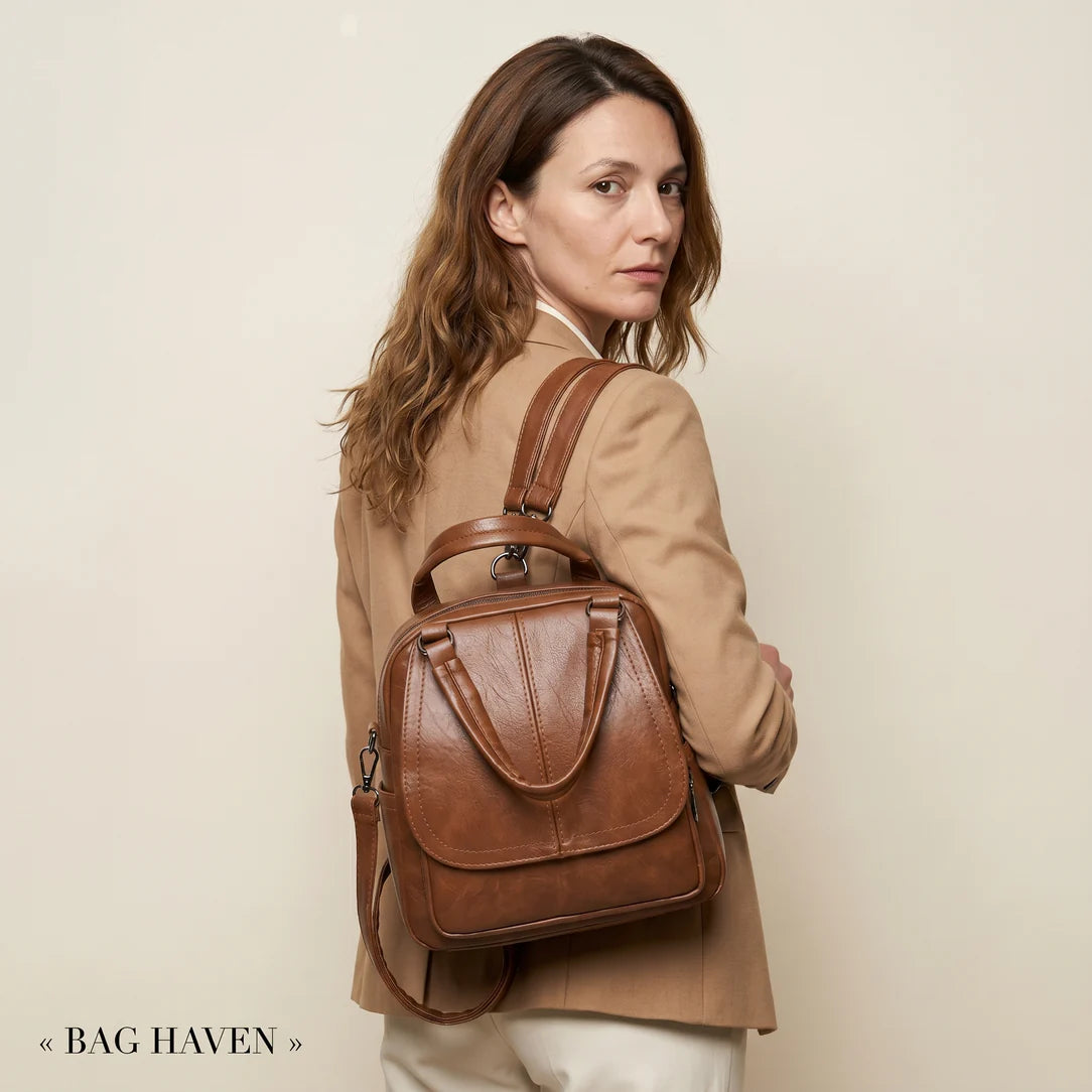 Sac à dos en pu lisse de ville serano en cuir marron avec poignée supérieure et bretelles ajustables