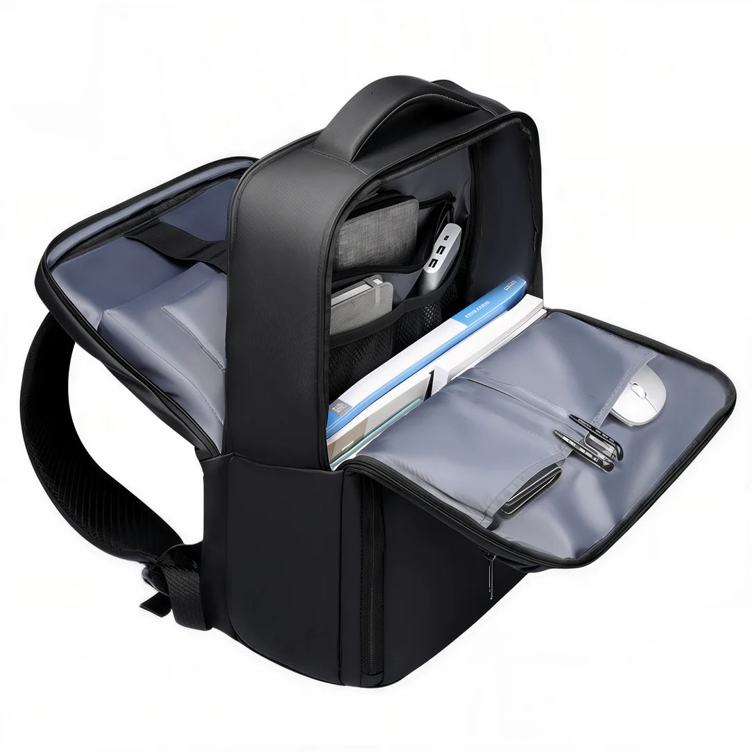 Sac à dos homme travail ordinateur Tenör X ouvert avec contenus visibles sur fond neutre