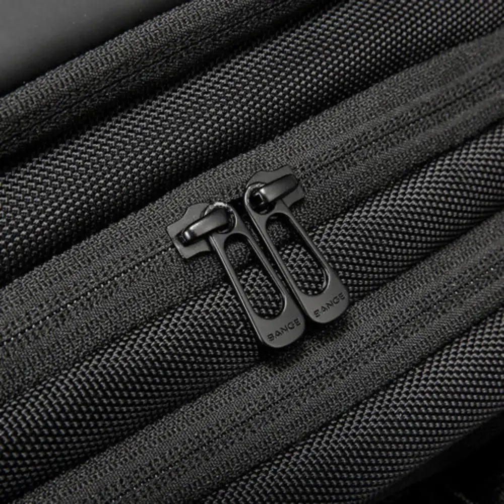 Tirettes de fermeture éclair texturées noires.