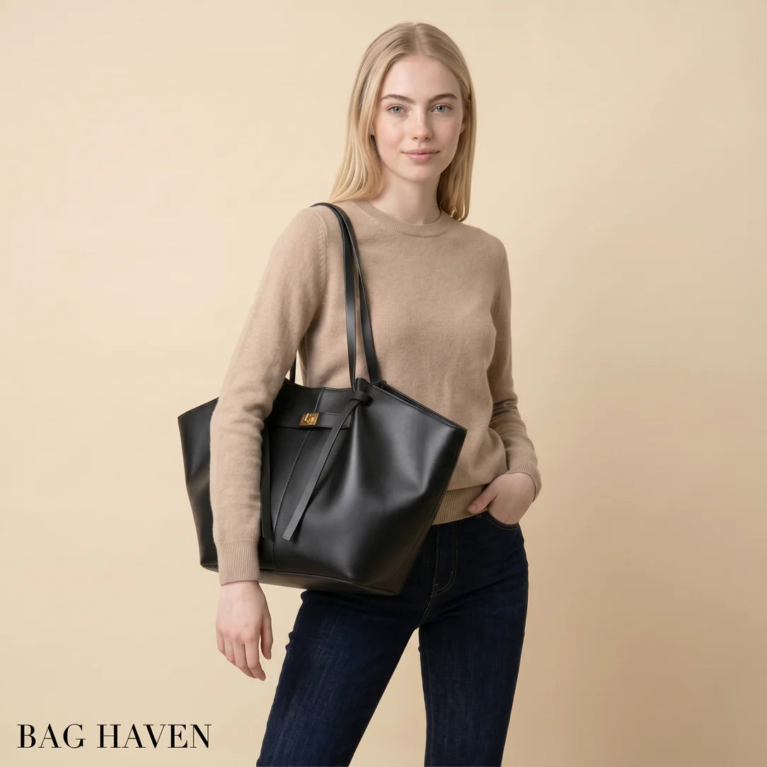 Sac à main en cuir noir grande capacité ines avec design structuré et fermeture en métal doré