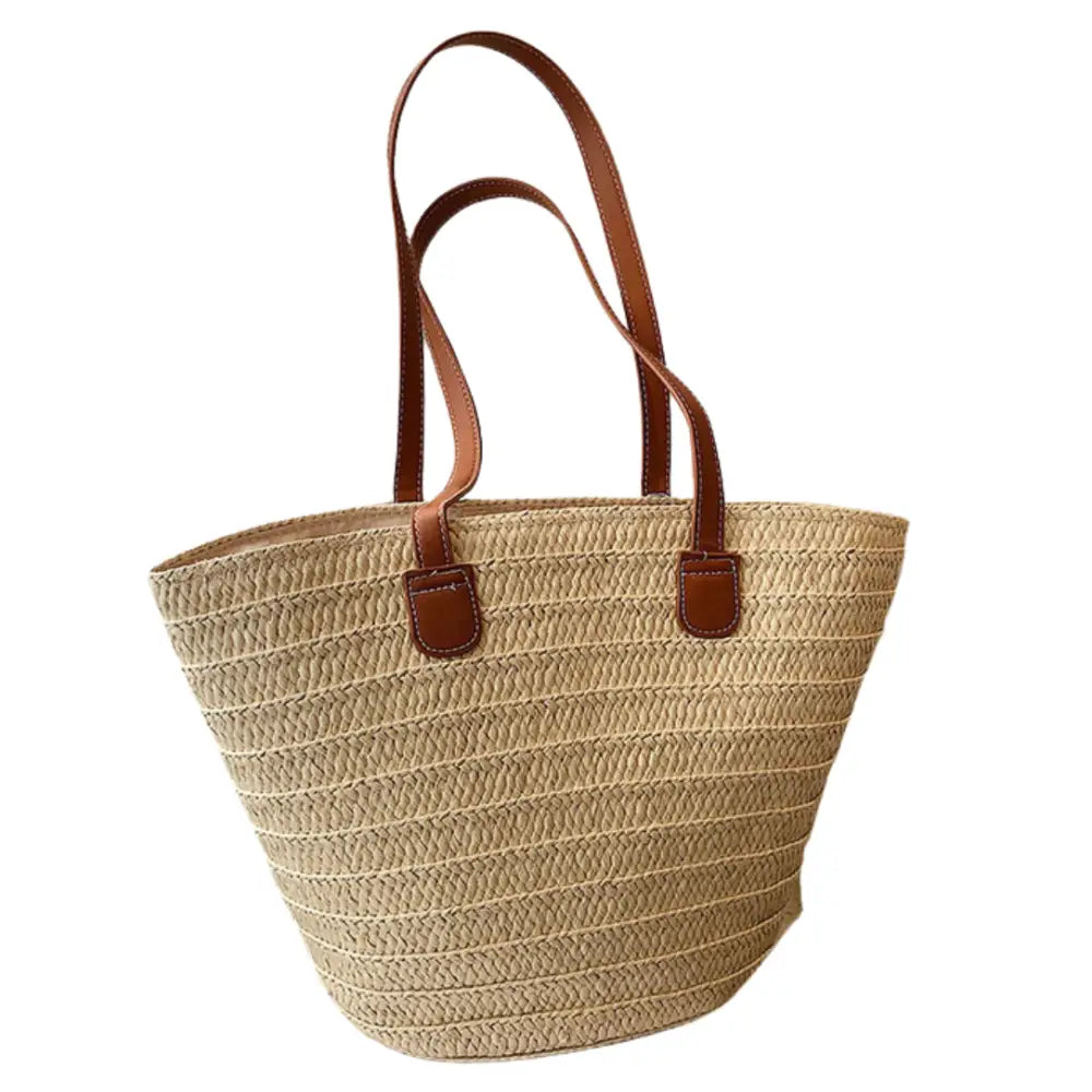 Sac à main en paille avec poignées en cuir marron, idéal pour un look naturel