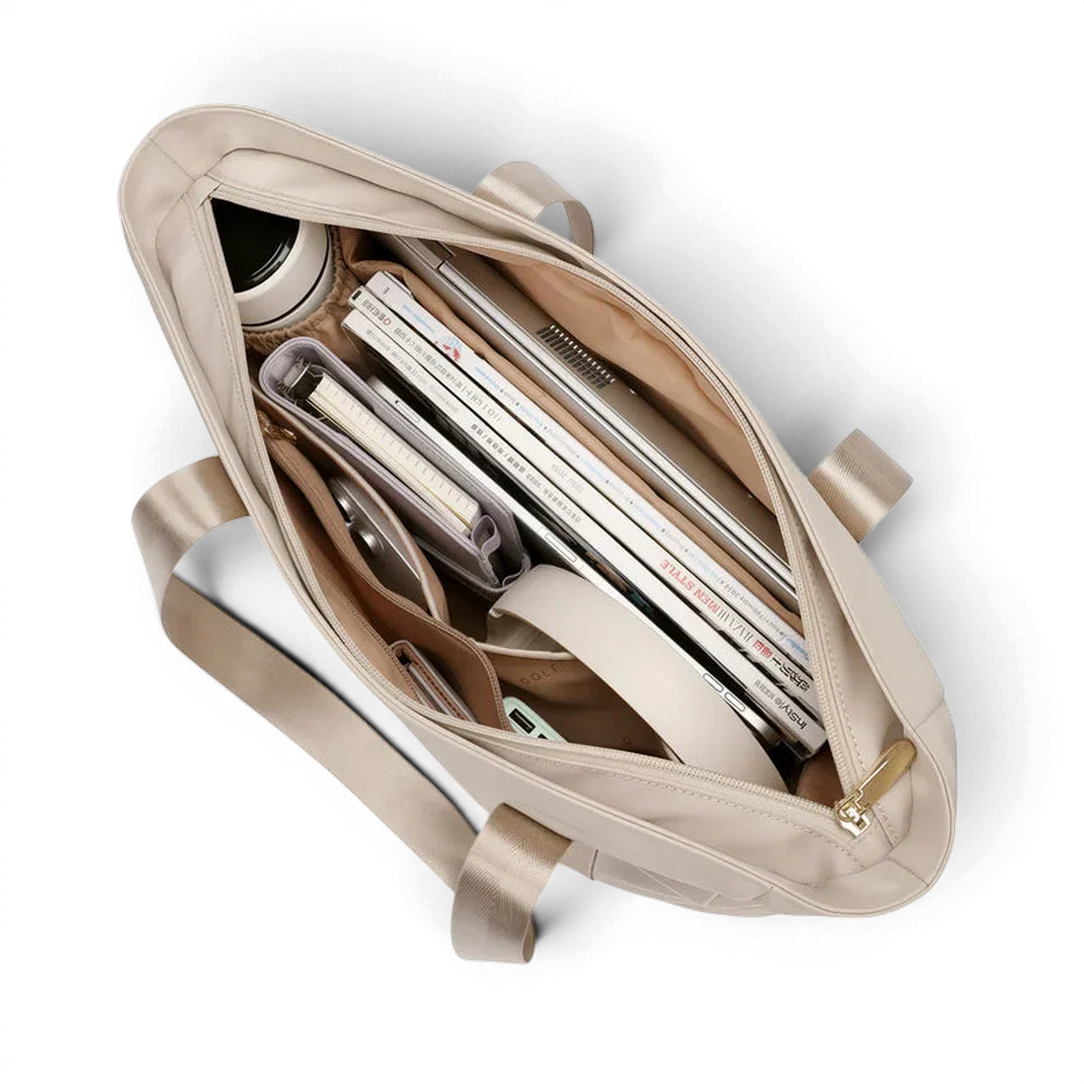 Sac de cour étudiante myriade beige en toile avec fermeture éclair dorée et bretelle ajustable rempli d effets personnels
