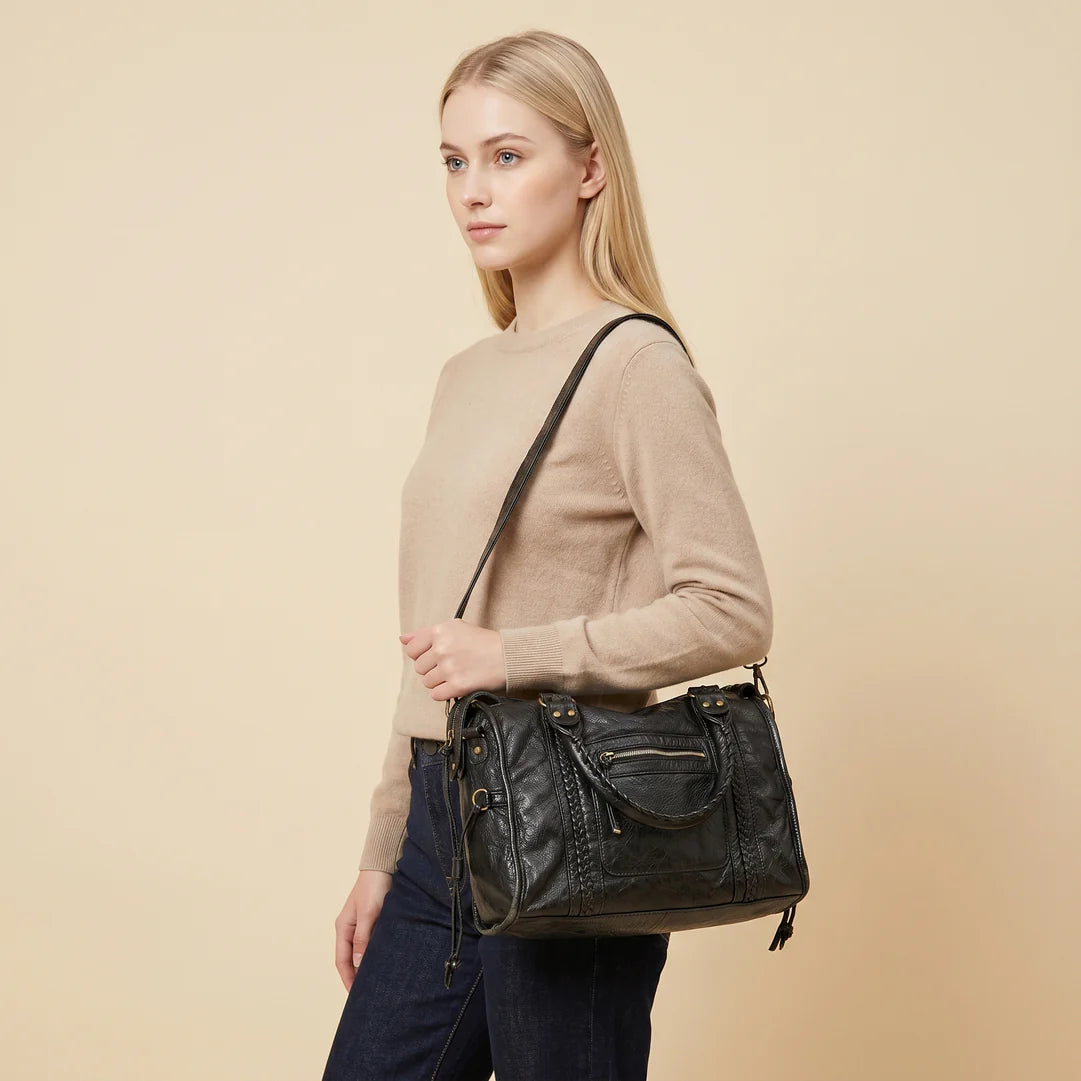 Sac de cours klassi sac bandoulière en cuir noir avec détails tressés et accents de tassel