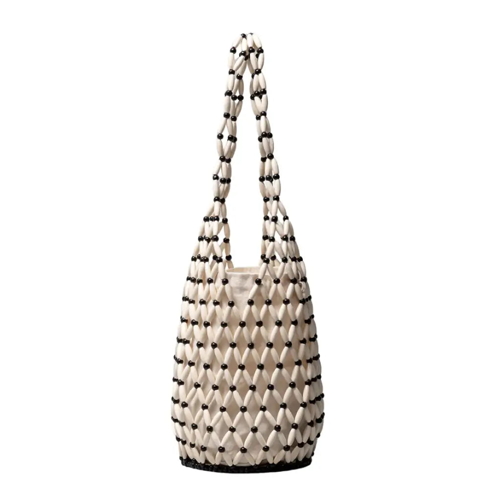 Sac de plage Cala en sac beaded avec design aéré pour un style naturel parfait pour les journées d’été