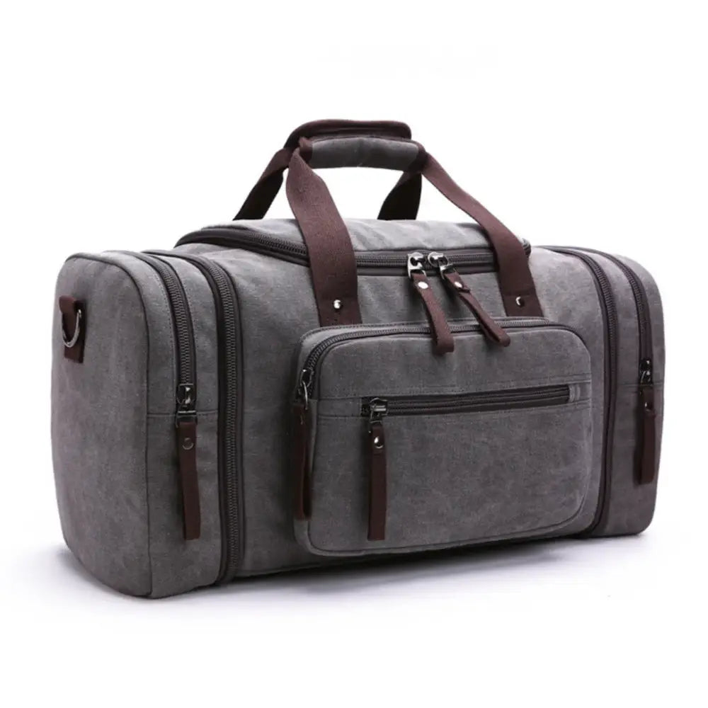 Sac de sport en toile grise avec des bretelles marron.