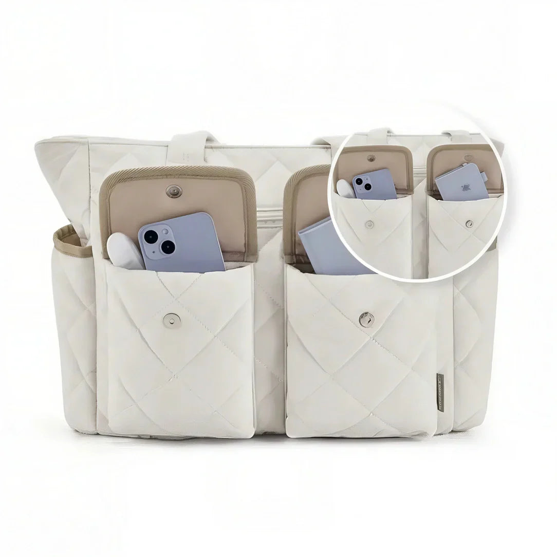 Sac fourre Tilda avec design quilté blanc, format spacieux et poches pour rythmes scolaires